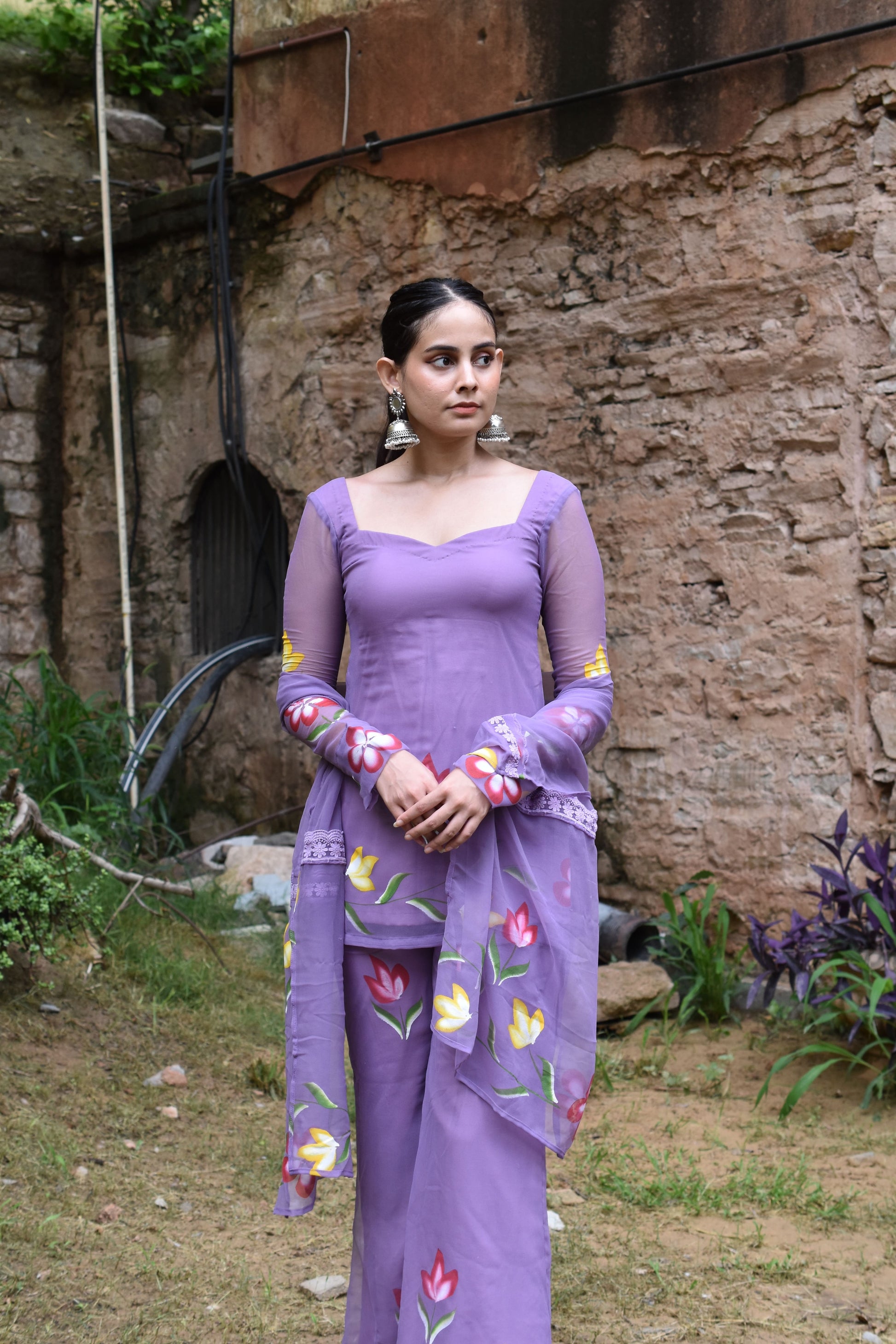 Georgette purple kurta with floral print and designer neckline.
