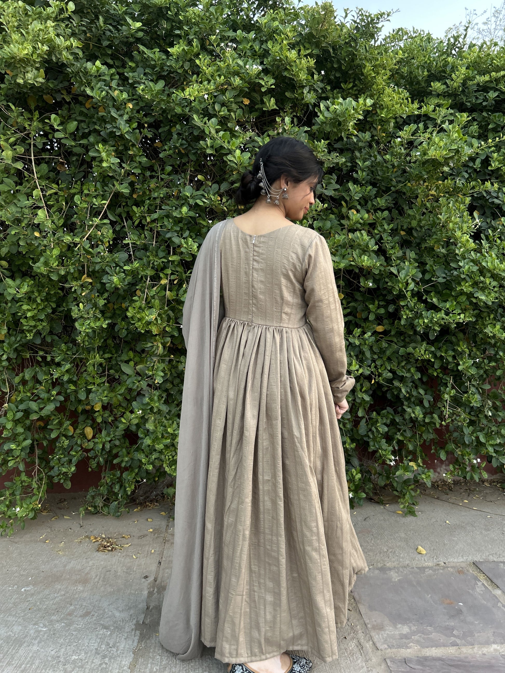Elegant light brown silk Anarkali suit with full sleeves and closed back.